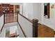 Upstairs hallway with hardwood floors and a view to the library at 3234 Lynwood Ne Dr, Atlanta, GA 30319