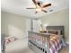 Bedroom featuring soft walls, natural light, and a ceiling fan at 3616 Longfellow Trl, Marietta, GA 30062