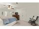 Bright bedroom featuring a ceiling fan, rocking chair, and natural light at 3616 Longfellow Trl, Marietta, GA 30062