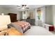 Cozy bedroom with natural lighting, neutral walls and ceiling fan at 3616 Longfellow Trl, Marietta, GA 30062