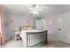 Bedroom featuring gray walls, pink curtains, and bright windows at 3616 Longfellow Trl, Marietta, GA 30062
