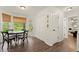 Eat-in dining area featuring a modern table set, natural light, and access to outdoor space at 3616 Longfellow Trl, Marietta, GA 30062