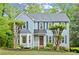 Charming two-story home with blue siding, a bay window, and a well-manicured front yard at 3616 Longfellow Trl, Marietta, GA 30062