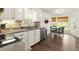 Bright kitchen featuring white cabinetry, stainless steel appliances, and a cozy breakfast nook at 3616 Longfellow Trl, Marietta, GA 30062