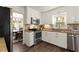 Well-lit kitchen featuring white cabinets, stainless steel appliances, and granite countertops at 3616 Longfellow Trl, Marietta, GA 30062