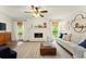 Bright and inviting living room with a fireplace, large windows, and elegant furnishings at 3616 Longfellow Trl, Marietta, GA 30062