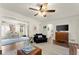 Spacious living room with hardwood floors, a cozy seating area, and plenty of natural light at 3616 Longfellow Trl, Marietta, GA 30062