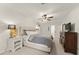 Comfortable main bedroom featuring a ceiling fan, large windows, and ample space at 3616 Longfellow Trl, Marietta, GA 30062