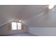 Finished attic space featuring a window, carpet and a unique angular ceiling at 3640 Longfellow Trl, Marietta, GA 30062