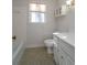 A bathroom features tile and fixtures, including a toilet, vanity, and bath tub at 3640 Longfellow Trl, Marietta, GA 30062