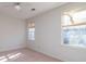 A bedroom is filled with natural light from two windows and features neutral paint at 3640 Longfellow Trl, Marietta, GA 30062