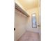 Walk-in closet featuring carpet, white walls, one shelf, and a framed full-length mirror at 3640 Longfellow Trl, Marietta, GA 30062