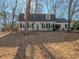Charming home with neutral siding, black shutters, and a well-maintained lawn, offering classic curb appeal at 3640 Longfellow Trl, Marietta, GA 30062