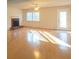 Bright and airy living room with hardwood floors, fireplace, and large windows that flood the space with natural light at 3640 Longfellow Trl, Marietta, GA 30062
