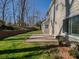 Playground with slide and swings surrounded by tall trees and woodchips, providing a fun and safe play area at 3640 Longfellow Trl, Marietta, GA 30062