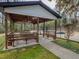 Poolside pavilion with ceiling fans, picnic tables and benches offering shade and a place to relax by the pool at 3640 Longfellow Trl, Marietta, GA 30062