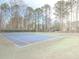 Tennis court with basketball goal offering a place for outdoor activities and recreation within the community at 3640 Longfellow Trl, Marietta, GA 30062