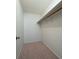 A walk-in closet has built-in shelving for closet organization at 3640 Longfellow Trl, Marietta, GA 30062