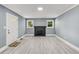 Living room with fireplace, hardwood floors, and neutral walls at 2168 Rhinehill Rd, Atlanta, GA 30315