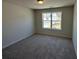 Empty bedroom with carpet at 226 Depot Landing Rd # 56, Auburn, GA 30011