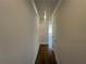 Hallway features dark wood flooring and neutral paint at 226 Depot Landing Rd # 56, Auburn, GA 30011