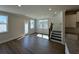 Bright living room featuring hardwood floors and modern white trim at 226 Depot Landing Rd # 56, Auburn, GA 30011