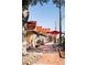Red-roofed shops line a brick walkway, creating a charming streetscape at 226 Depot Landing Rd # 56, Auburn, GA 30011