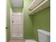 Simple bathroom with shower, toilet and shelving at 3599 Woodbriar Cir # G, Tucker, GA 30084