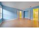 Bright bedroom featuring blue walls, wood flooring, and a large closet at 3599 Woodbriar Cir # G, Tucker, GA 30084