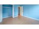 Bedroom with light blue walls and wood-look flooring at 3599 Woodbriar Cir # G, Tucker, GA 30084