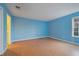 Spacious bedroom with light blue walls and wood-look flooring at 3599 Woodbriar Cir # G, Tucker, GA 30084