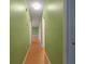 Simple hallway with light wood flooring and green walls at 3599 Woodbriar Cir # G, Tucker, GA 30084