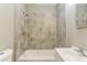 Bathroom featuring tile surround bathtub, single sink, and chrome fixtures at 1116 Northwest Nw Dr, Atlanta, GA 30318