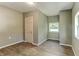 A bedroom featuring wood-look flooring, a window, and a closet at 1116 Northwest Nw Dr, Atlanta, GA 30318