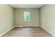 A bedroom featuring wood-look flooring and a window view of outside at 1116 Northwest Nw Dr, Atlanta, GA 30318