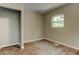 A bedroom featuring wood-look flooring and a window view of outside at 1116 Northwest Nw Dr, Atlanta, GA 30318