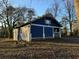 Side view of a charming blue house with a yard at 1116 Northwest Nw Dr, Atlanta, GA 30318