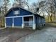 Blue house with white trim, front porch, and a yard at 1116 Northwest Nw Dr, Atlanta, GA 30318