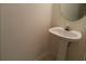 Small half bathroom with pedestal sink and mirror at 2962 Vining Ridge Ln, Decatur, GA 30034