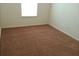 Bright bedroom with neutral carpeting and large window at 2962 Vining Ridge Ln, Decatur, GA 30034