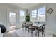 Dining area with rustic wood table and access to balcony at 224 Depot Landing Rd # 57, Auburn, GA 30011