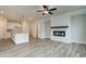 Open living room showcasing a fireplace and kitchen view at 224 Depot Landing Rd # 57, Auburn, GA 30011