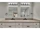 Modern bathroom with double vanity, quartz countertop, and black fixtures at 3002 Sawtooth Cir, Alpharetta, GA 30022