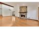 Living room with hardwood floors, stone fireplace and large windows at 3002 Sawtooth Cir, Alpharetta, GA 30022