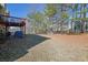 Private backyard with mature trees and a deck at 3643 Southland Ne Dr, Buford, GA 30519
