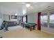 Basement recreation area with pool table and seating at 3643 Southland Ne Dr, Buford, GA 30519