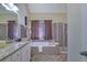 Bathroom with soaking tub, shower, and granite countertops at 3643 Southland Ne Dr, Buford, GA 30519