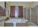 Bathroom with garden tub, shower, and granite countertops at 3643 Southland Ne Dr, Buford, GA 30519
