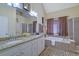Double vanity bathroom with a large soaking tub and shower at 3643 Southland Ne Dr, Buford, GA 30519