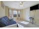 Bedroom with a futon and large window at 3643 Southland Ne Dr, Buford, GA 30519